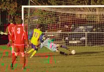 Town win again to extend lead at top