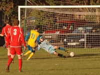 Town win again to extend lead at top