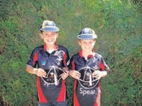 Boys receive schools caps
