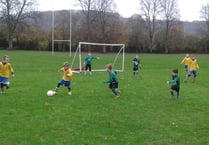 Juniors play on despite the wind and rain