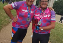 Fundraising pair pedal to the palace for Well Child charity