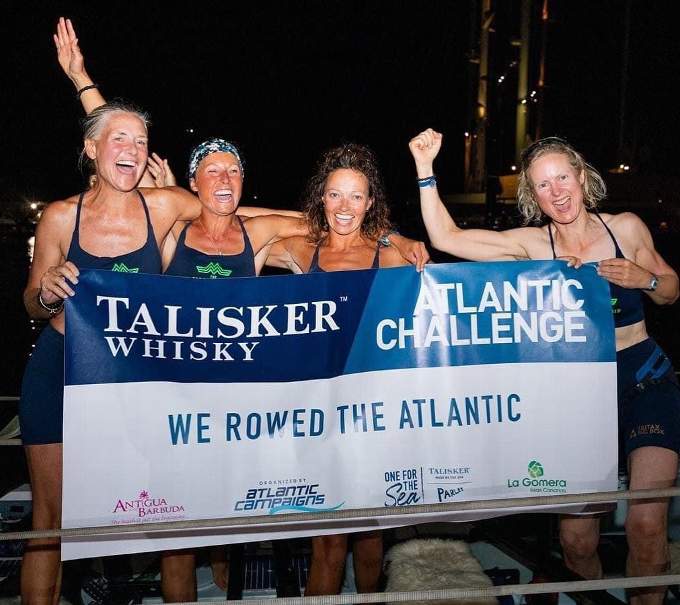 Felicity Ashley (second from right) and sister Pippa Edwards (second from left) celebrate completing the Talisker Whisky Atlantic Challenge with 'Mothership' crew-mates Jo Blackshaw and Lebby Eyres. Photo: Talisker Atlantic Challenge