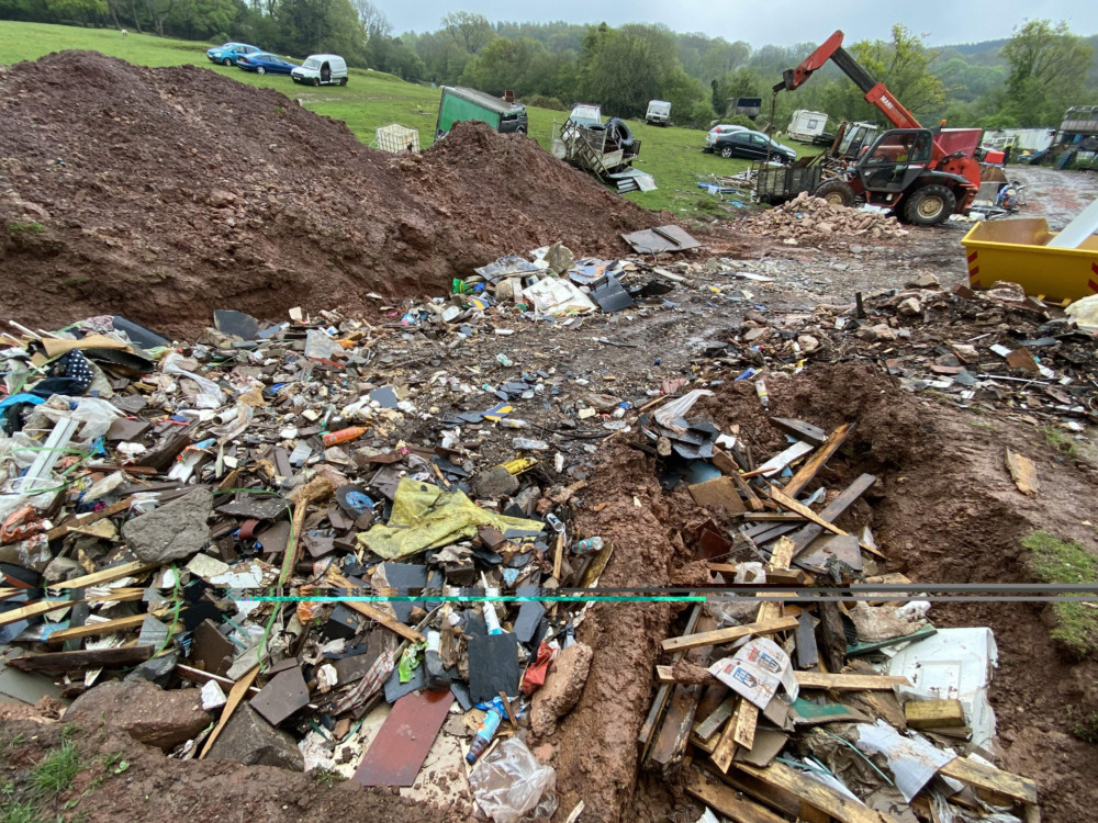 Some of the cars and a pile of rubbish at Doward farm