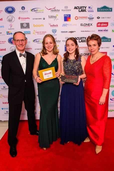 Holly and Emily Walker with their parents, Tim and Debbie, at the Child of Wales Awards 2022 in Cardiff
