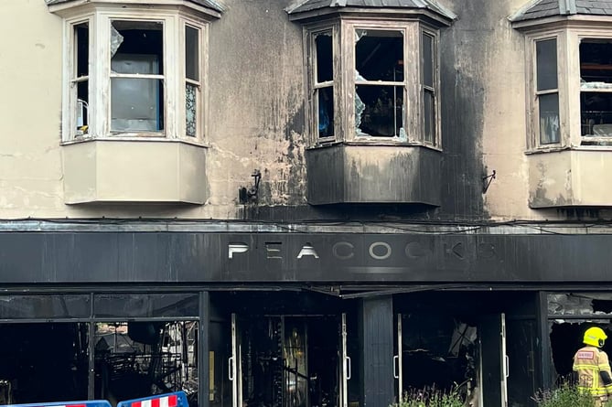 The Peacocks store stands as just a shell following the devastating fire