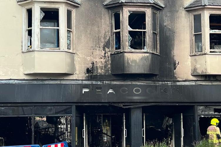 The Peacocks store stands as just a shell following the devastating fire