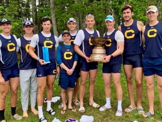 Old Monmothian Iwan Hadfield, right, pictured holding the Pacs 12 trophy after winning California-Berkeley