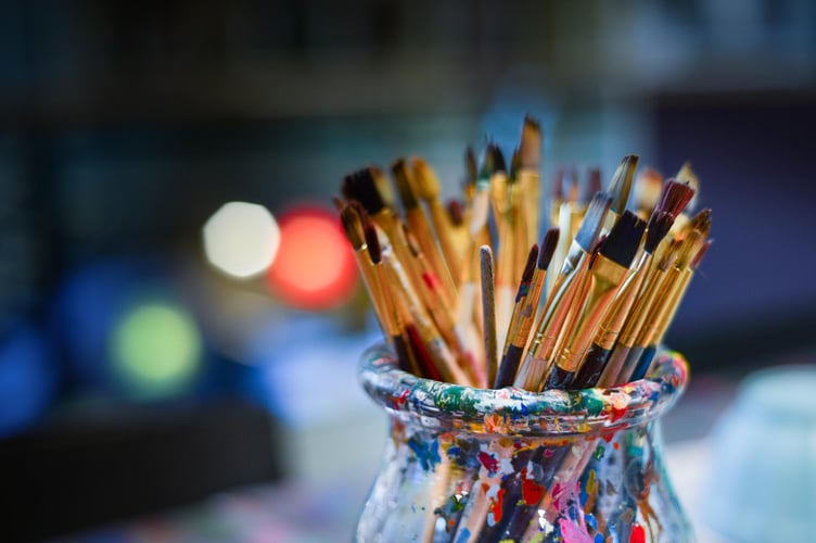 Paint brushes ready for a workshop.