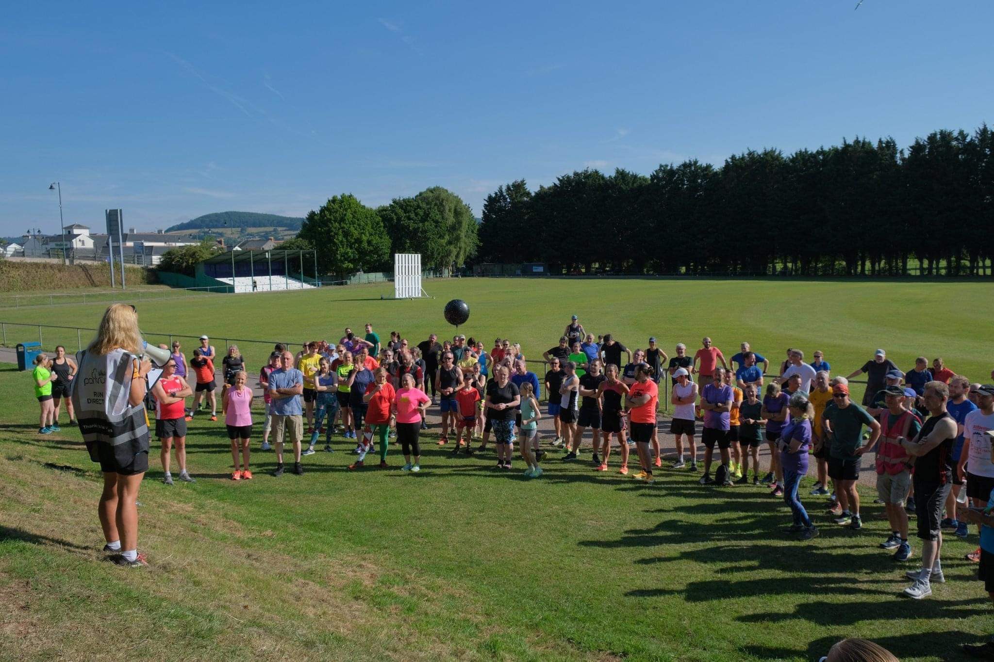 Runners gather for a parkrun event