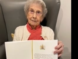 Mrs Muriel Bratchell of Monmouthshire with 100th birthday card from the King