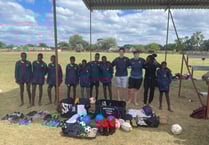 Students play Santa with sport gear gifts for Lions