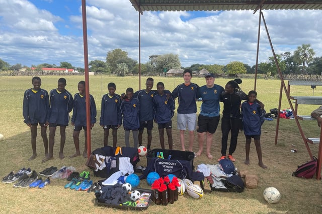 Students play Santa with sport gear gifts for Lions