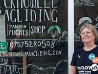 Jane marks 80th birthday with charity paraglide into Castle Meadows