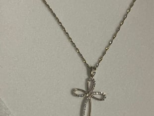 Necklace stolen in house raid 