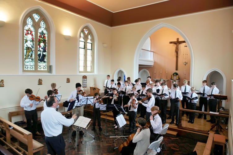 Choir practising before tour