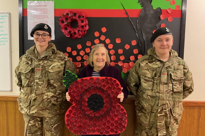 the Coleford Platoon of the ACF Gloucestershire presented deputy town mayor Cllr Marilyn Cox with a giant poppy, made from recycled bottle tops,