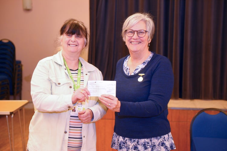 handing over a cheque to Ty Hafan