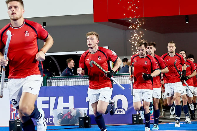 Jacob Draper, second from left, runs out with the GB hockey team
