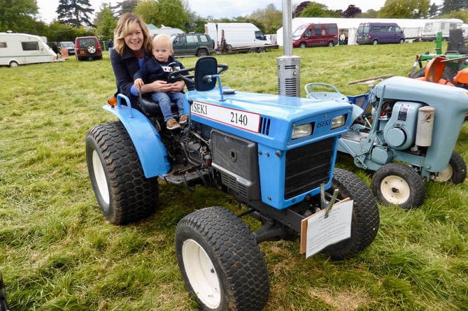 A tractor held an attraction for this youngster