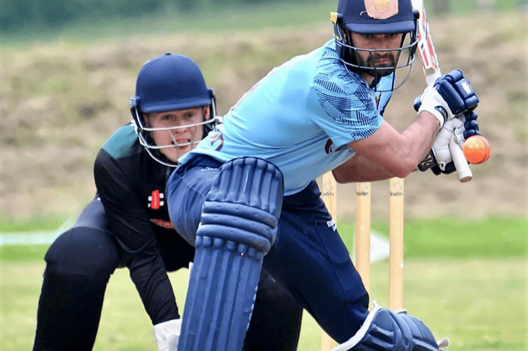 A St Fagans player looks for the boundary.