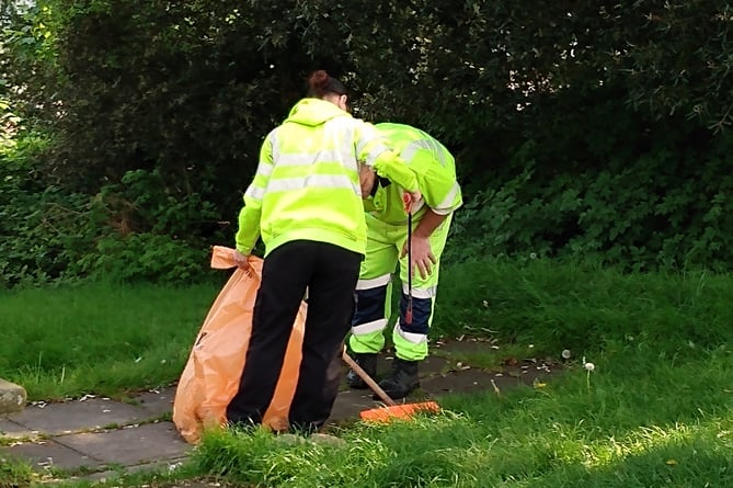 Monmouthshire County Council staff clearing waste from the car park where Travellers had stayed. Picture: LDRS