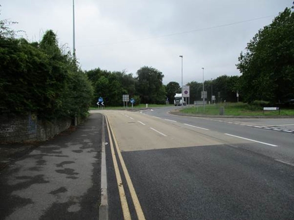 Chepstow's Highbeech roundabout: A48 Westwards Highbeech roundabout access junction with added white line dual-lane alignment safety road signage