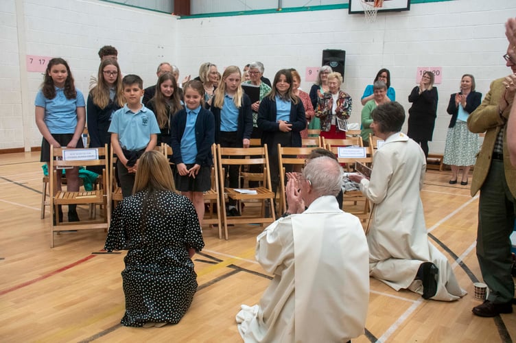 Archbishop Justin and Bishop Rachel Treweek applaud the Tutshill School choir