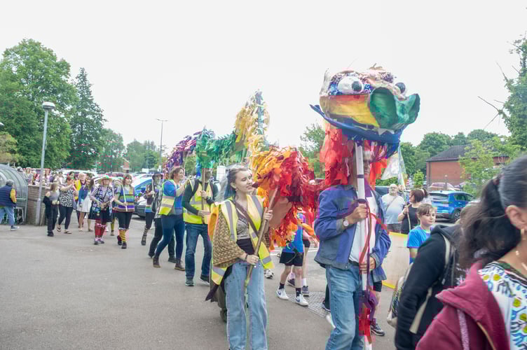 The dragon makes its way towards the clock tower.