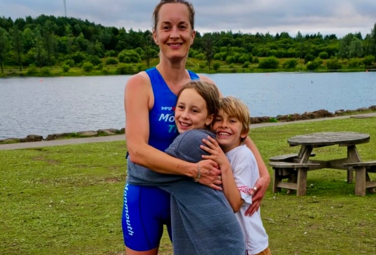 Kelly Major and supporters Fred and Ella celebrate at the NEWT Parc Bryn Bach aquathlon