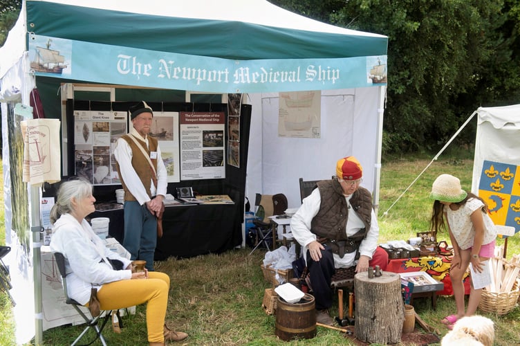 Hearing about the history of Newport's medieval shop and how coins were stamped