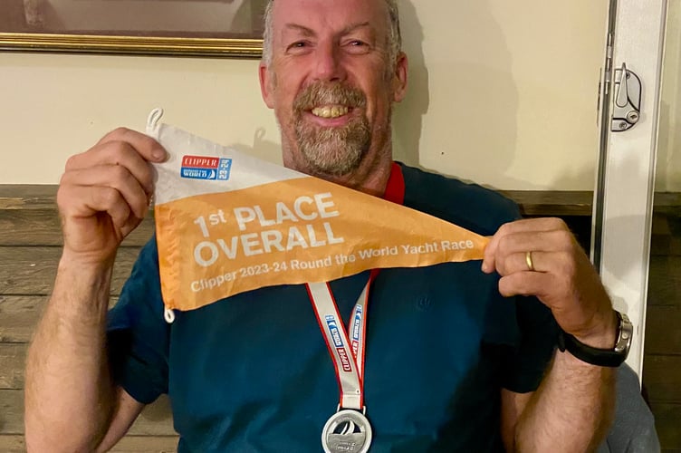 Eric Froggatt with his Clipper Round the World winner's pennant and circumnavigation medal 