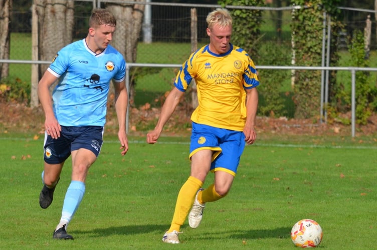 A Kingfishers player shields the ball
