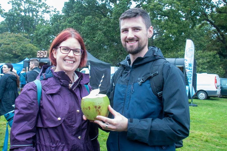 Nicki Millard and Samuel Barker of Ruardean enjoying a natural fruit juice from a coconut.