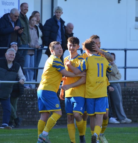 Monmouth Town players celebrate a goal