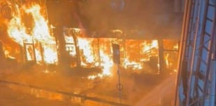 Fire fighters battle to save historic town centre shops in Abergavenny