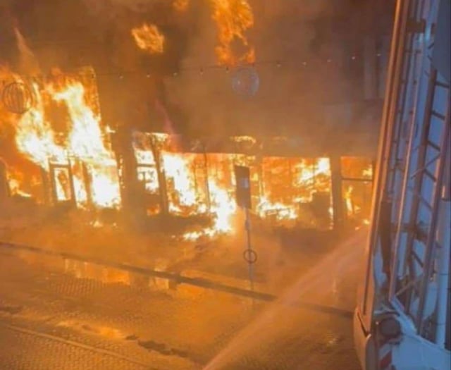 Fire fighters battle to save historic town centre shops in Abergavenny