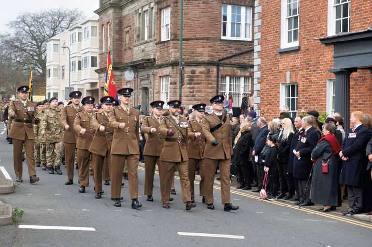Servicemen from the Royal Monmouthshire Royal Engineers (M) and other regiments lead the parade