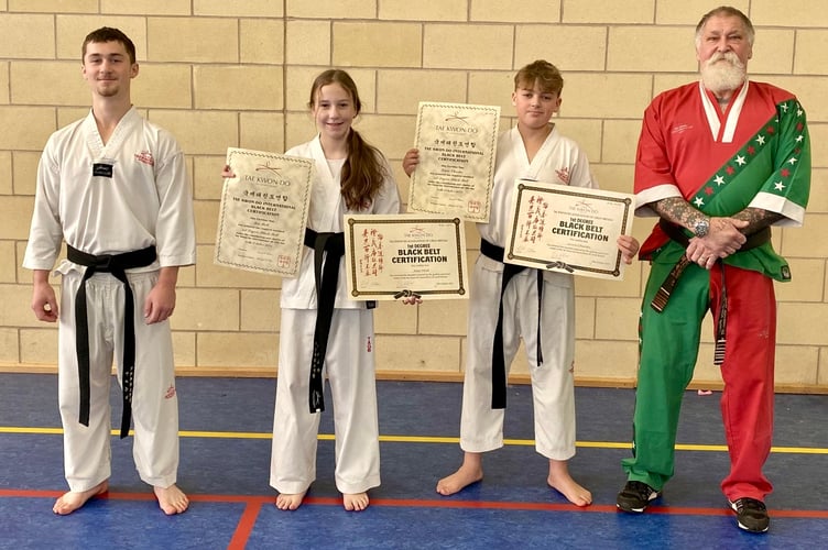 Geraint (far left), Mia and Lewis (right) pictured with World Master Anthony Farr.  