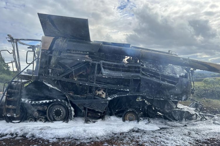 Burnt out combine harvester