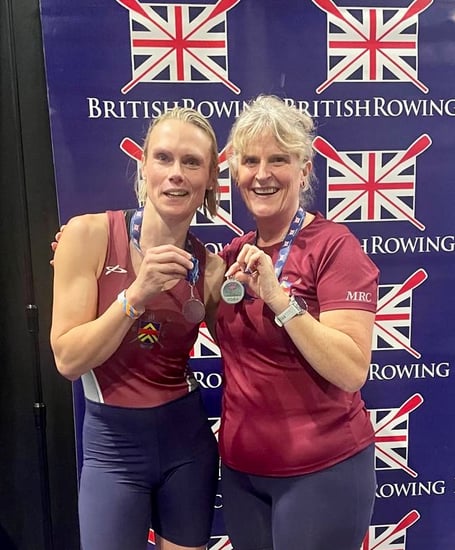 Fliss Howes, left, and Lou Tanner with their British Rowing Indoor silver medals