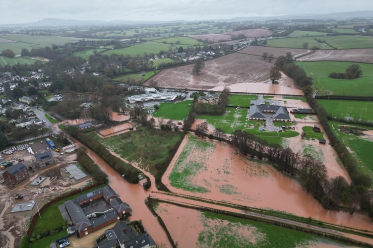 This photo taken from a drone following Storm Bert shows parts of Raglan underwater with the development site at the northern end of the village above the level