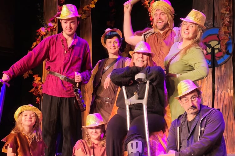 Sam surrounded by some of the cast and crew, including some Savoy Youth Theatre members