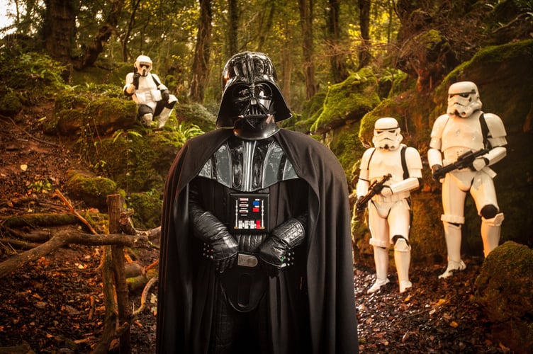 FILE PHOTO - Star Wars characters promote 'Star Wars: Episode VII The Force Awakens' in the Forest of Dean. Photo released December 12 2024. Researchers have begun studying the environmental impacts of Star Wars location shooting - over fears it disrupted a famous woodland.Puzzlewood, in the Forest of Dean, was an important filming location for Star Wars 'The Force Awakens' in 2014.If you were one of the many Star Wars fans who caught sight of the film crews descending on the Forest of Deanâs ancient Puzzlewood for iconic then an Open University research academic wants to hear from you.Dr Rebecca Harrison works in the OUâs Film and Media department and is conducting a study called the âEnvironmental Impact of Filmmaking (EIF)â using Star Wars, its film props and locations as the theme.

