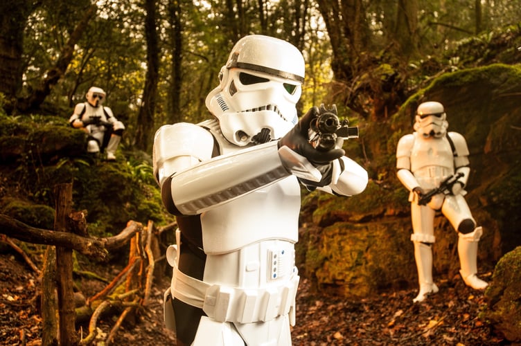 FILE PHOTO - Star Wars characters promote 'Star Wars: Episode VII The Force Awakens' in the Forest of Dean. Photo released December 12 2024. Researchers have begun studying the environmental impacts of Star Wars location shooting - over fears it disrupted a famous woodland.Puzzlewood, in the Forest of Dean, was an important filming location for Star Wars 'The Force Awakens' in 2014.If you were one of the many Star Wars fans who caught sight of the film crews descending on the Forest of Deanâs ancient Puzzlewood for iconic then an Open University research academic wants to hear from you.Dr Rebecca Harrison works in the OUâs Film and Media department and is conducting a study called the âEnvironmental Impact of Filmmaking (EIF)â using Star Wars, its film props and locations as the theme.
