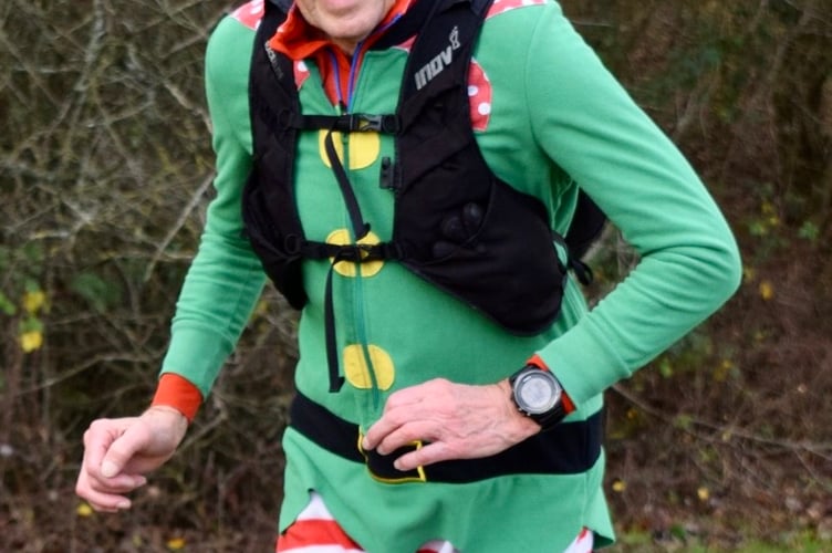 A festive runner in the Skirrid Winter Fell Run
