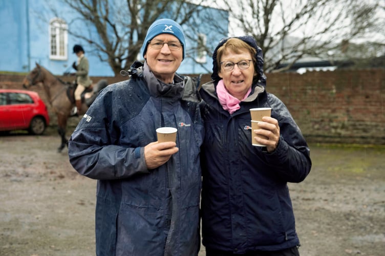 Two familiar faces enjoy the mulled wine