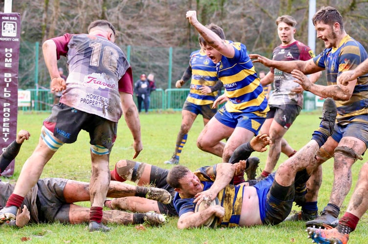Monmouth's Adam Roberts crashes over for his side's try