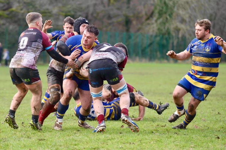 Monmouth's Rhodri Williams looks for a gap with Joe Chrstopher in support