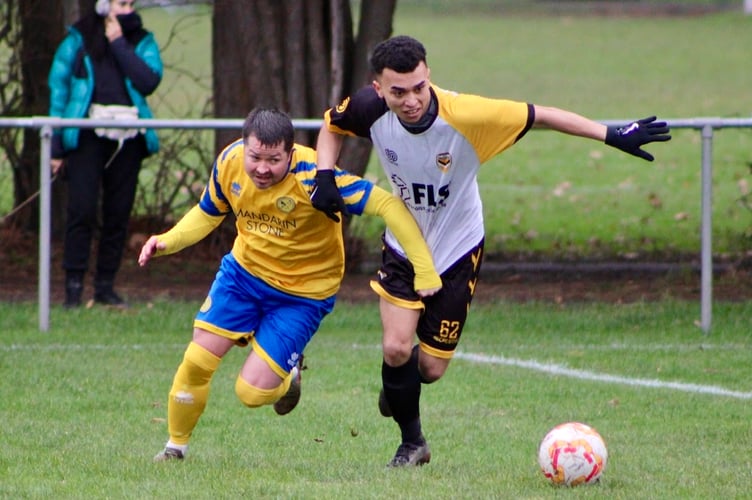 Dan MacDonald competes for the ball