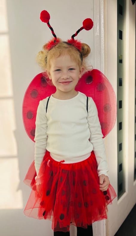 Charlotte aged five dressed up for World Book Day as a ladybird 